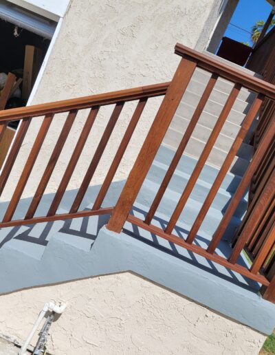 Wooden porch railing in the process of installation or repair outside a residential building.